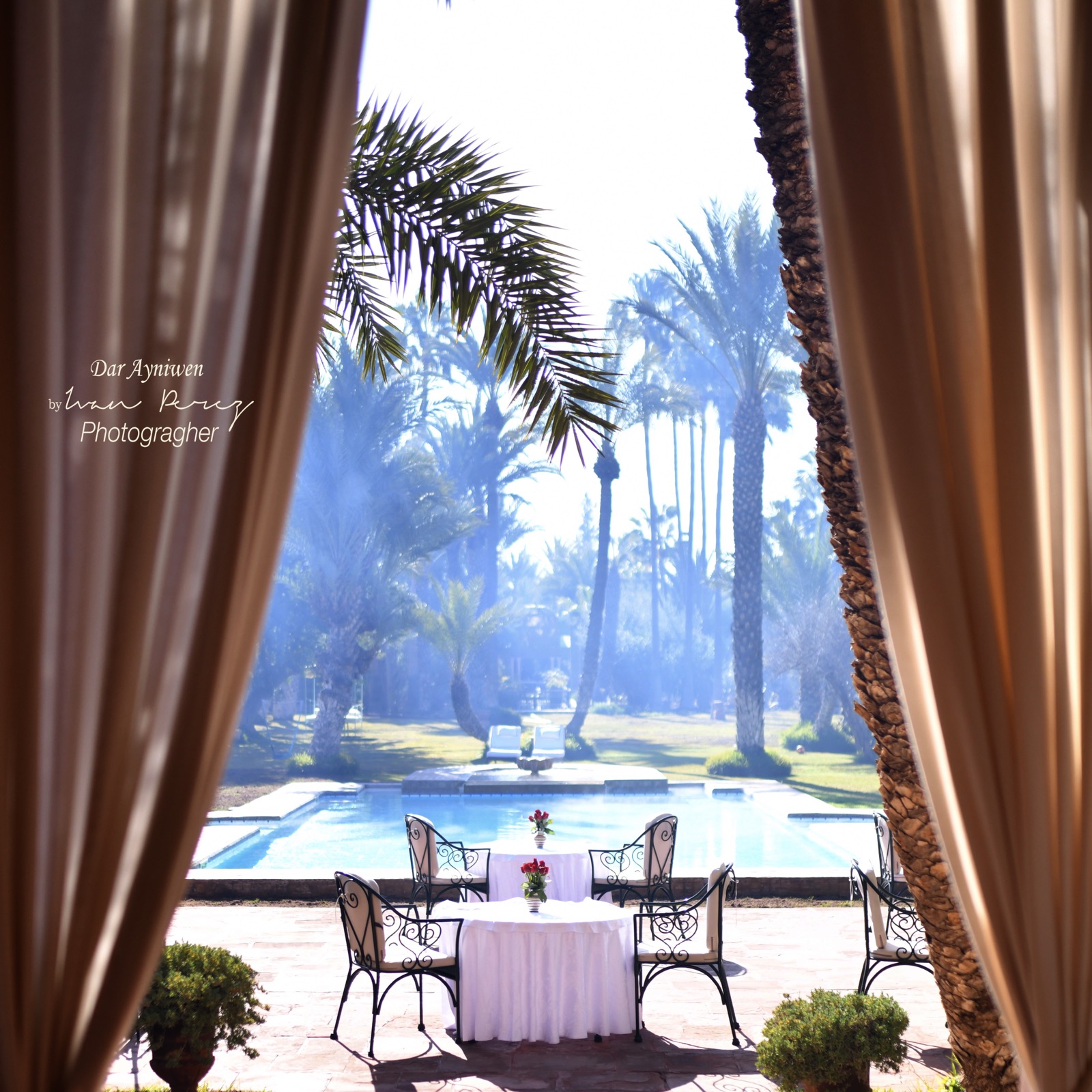 A small zellige-tiled plunge pool in a shaded traditional Marrakech riad courtyard