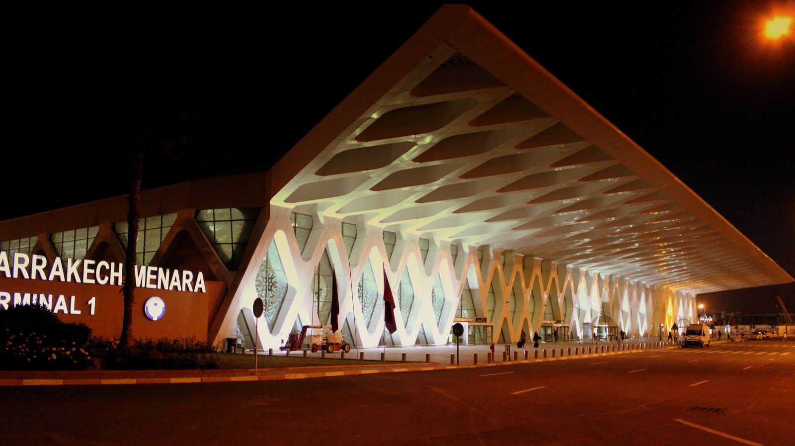 Traveller checking mobile signal on arrival at a Moroccan airport