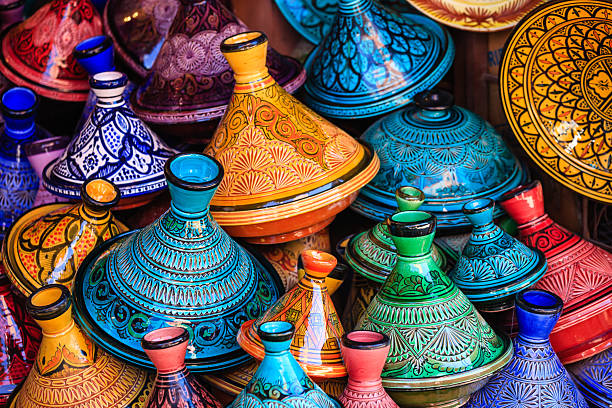 A traveller checking a phone at a kasbah on the edge of the desert