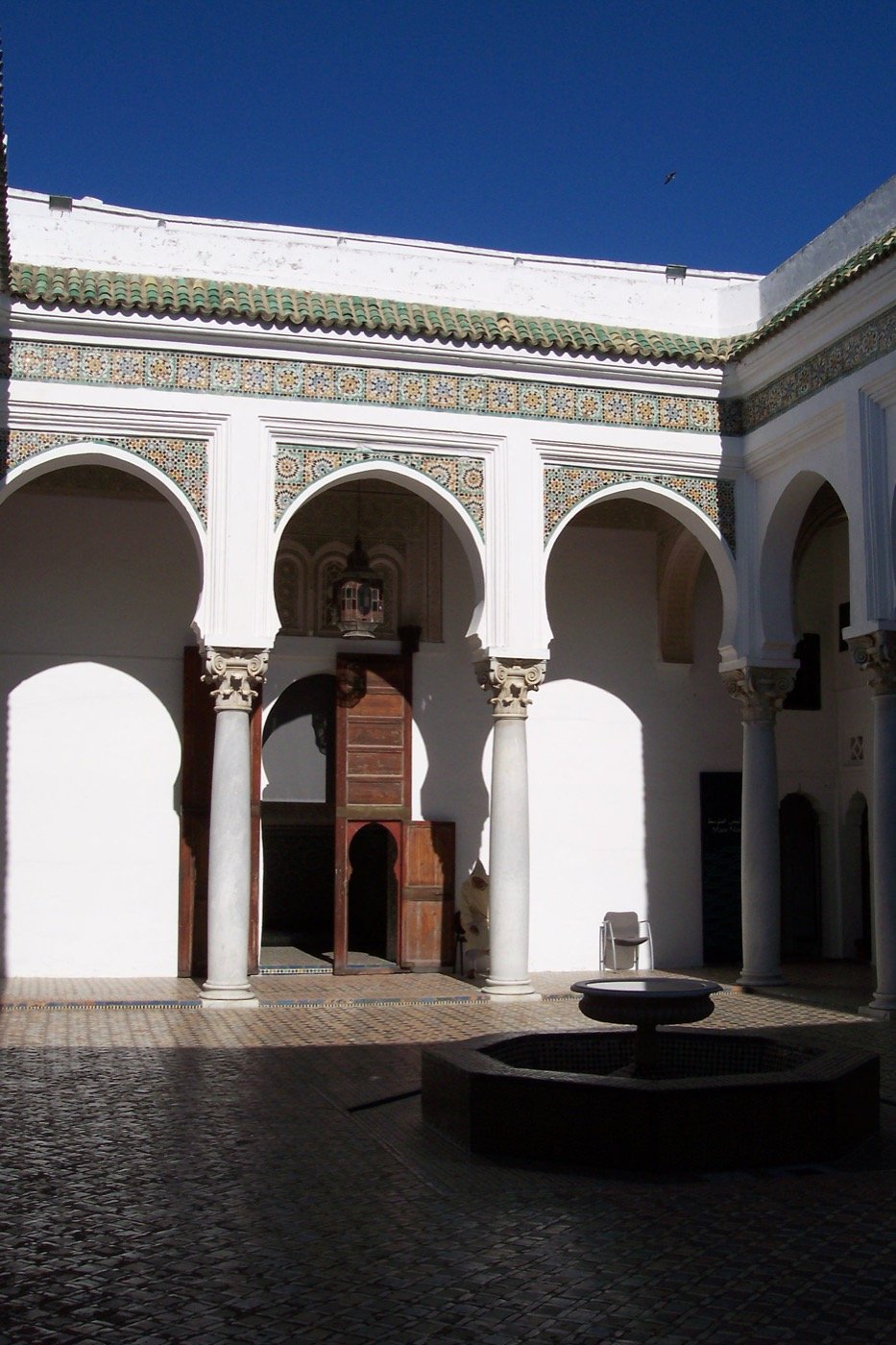 Quiet whitewashed lane with blue doors in the Tangier Kasbah