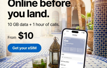 Smartphone showing full mobile signal on a Moroccan tiled café table