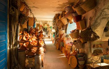 Artisan carving thuya wood in a traditional Essaouira workshop