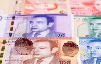 Official currency exchange counter in a Moroccan airport arrivals hall